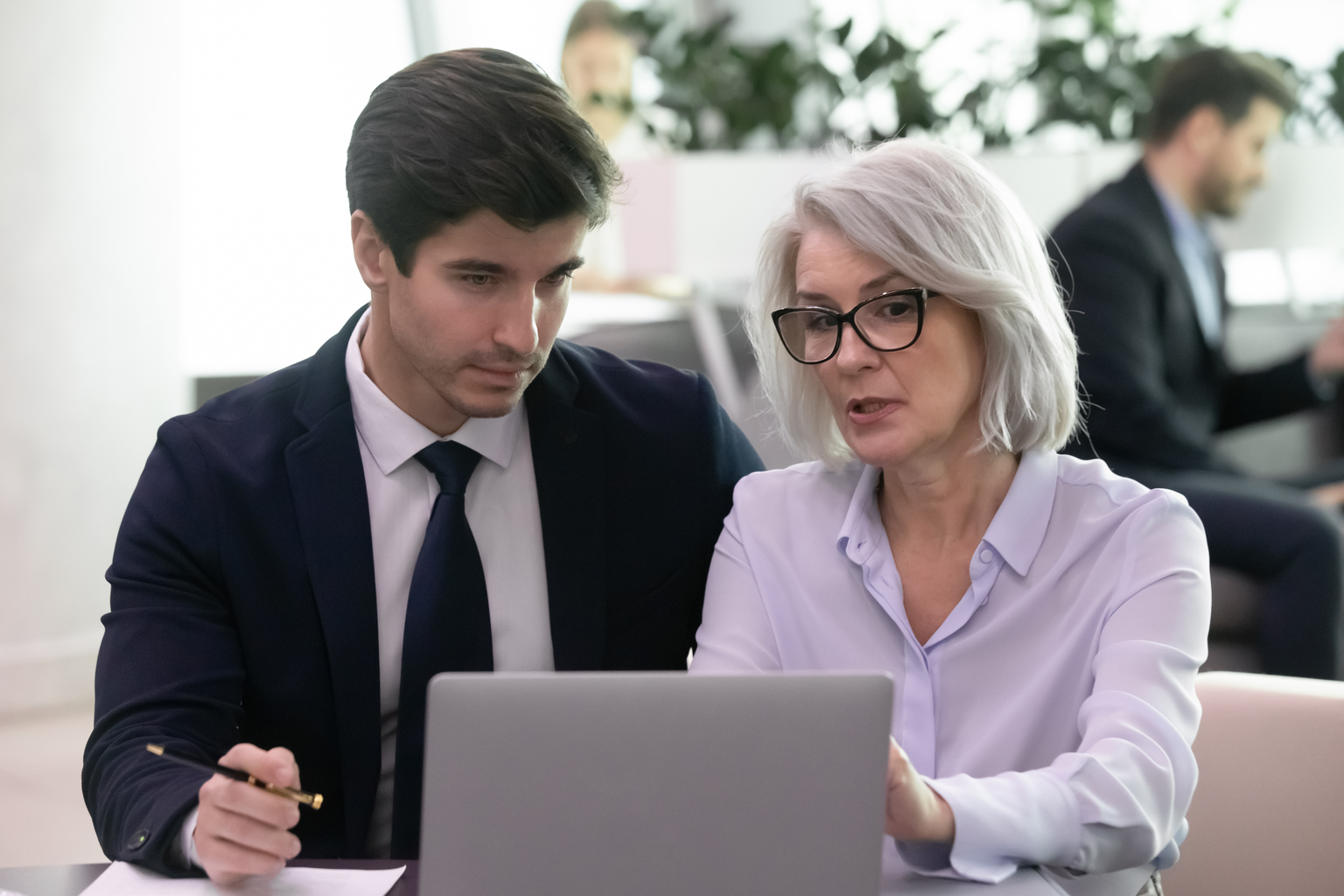 Man and woman looking at laptop 