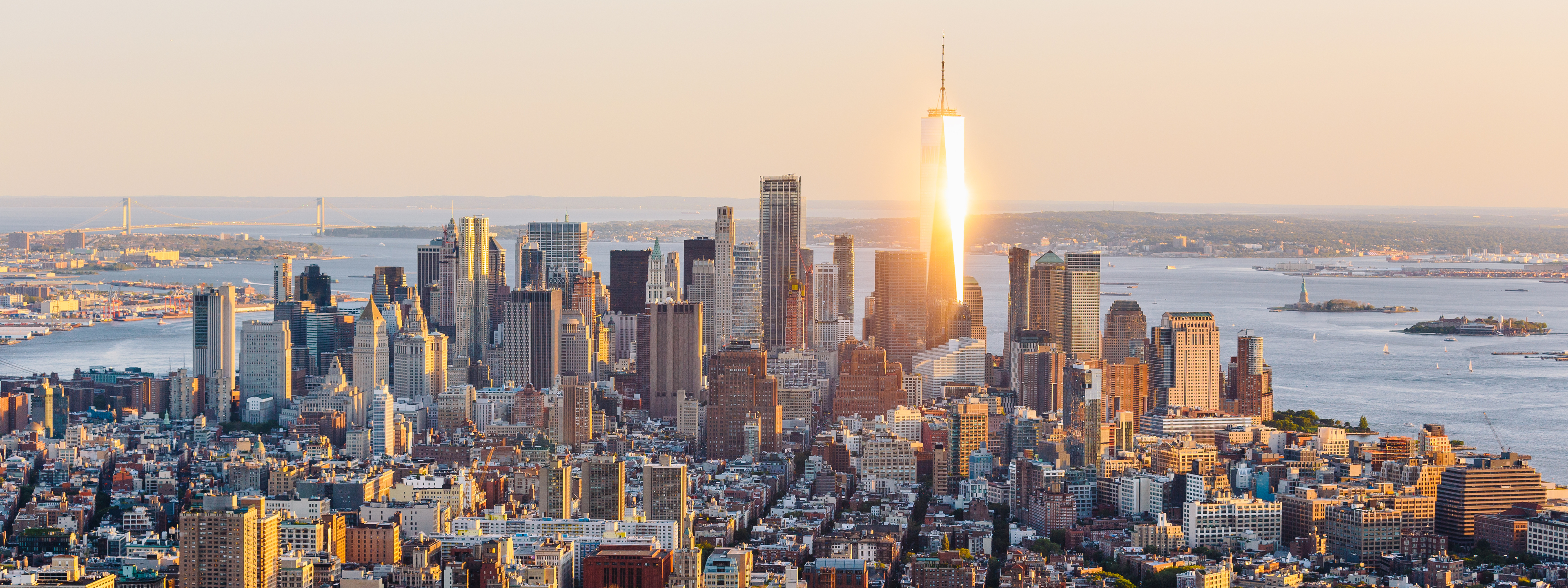 New York skyline with Manhattan Financial District and One World Trade Center at sunset, NY, USA,
