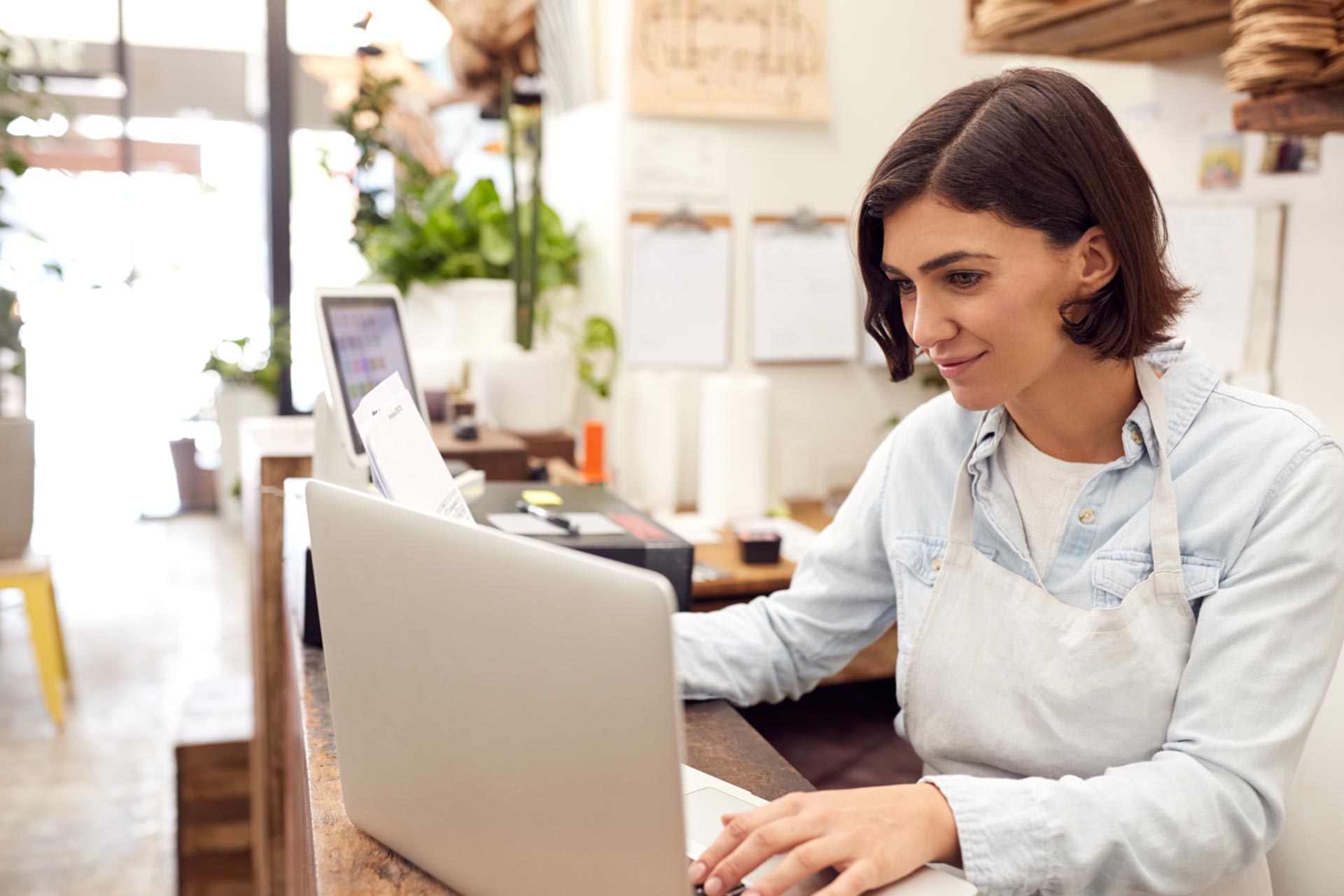 DBA business owner checking her laptop