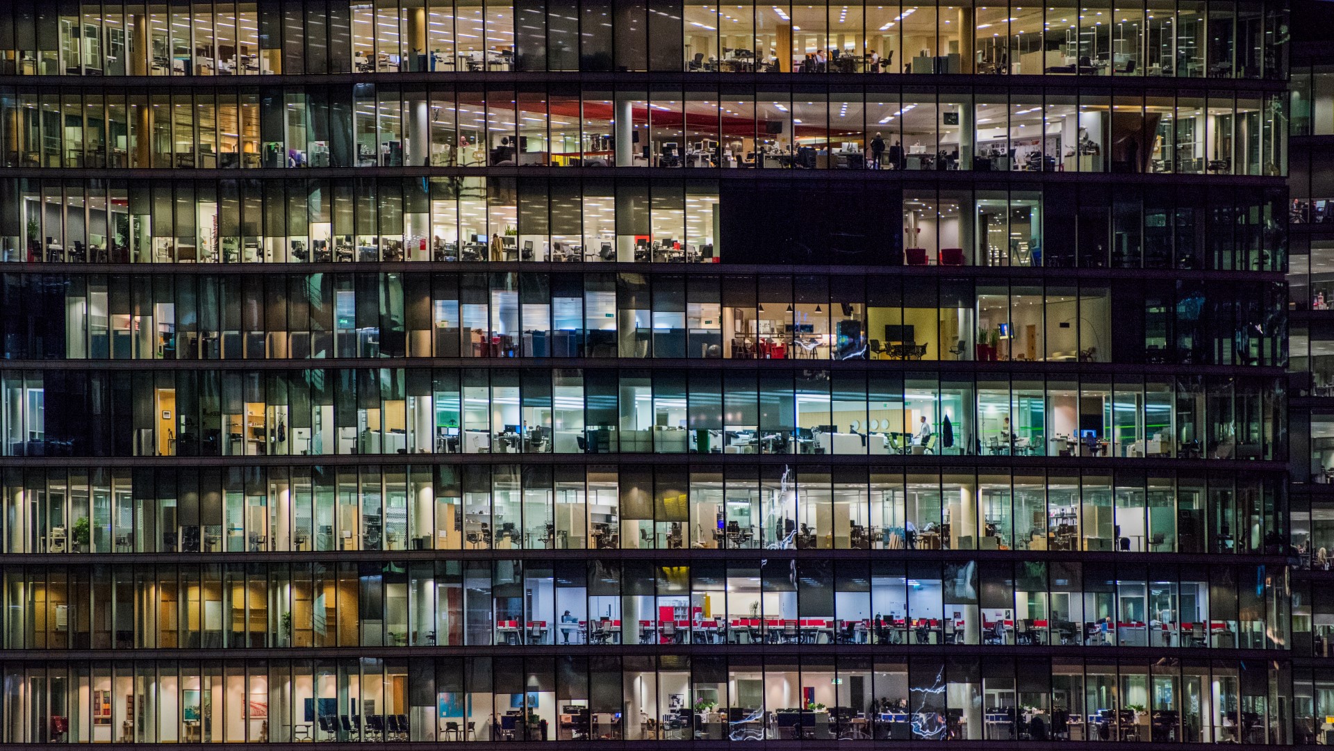 Glass office building at night