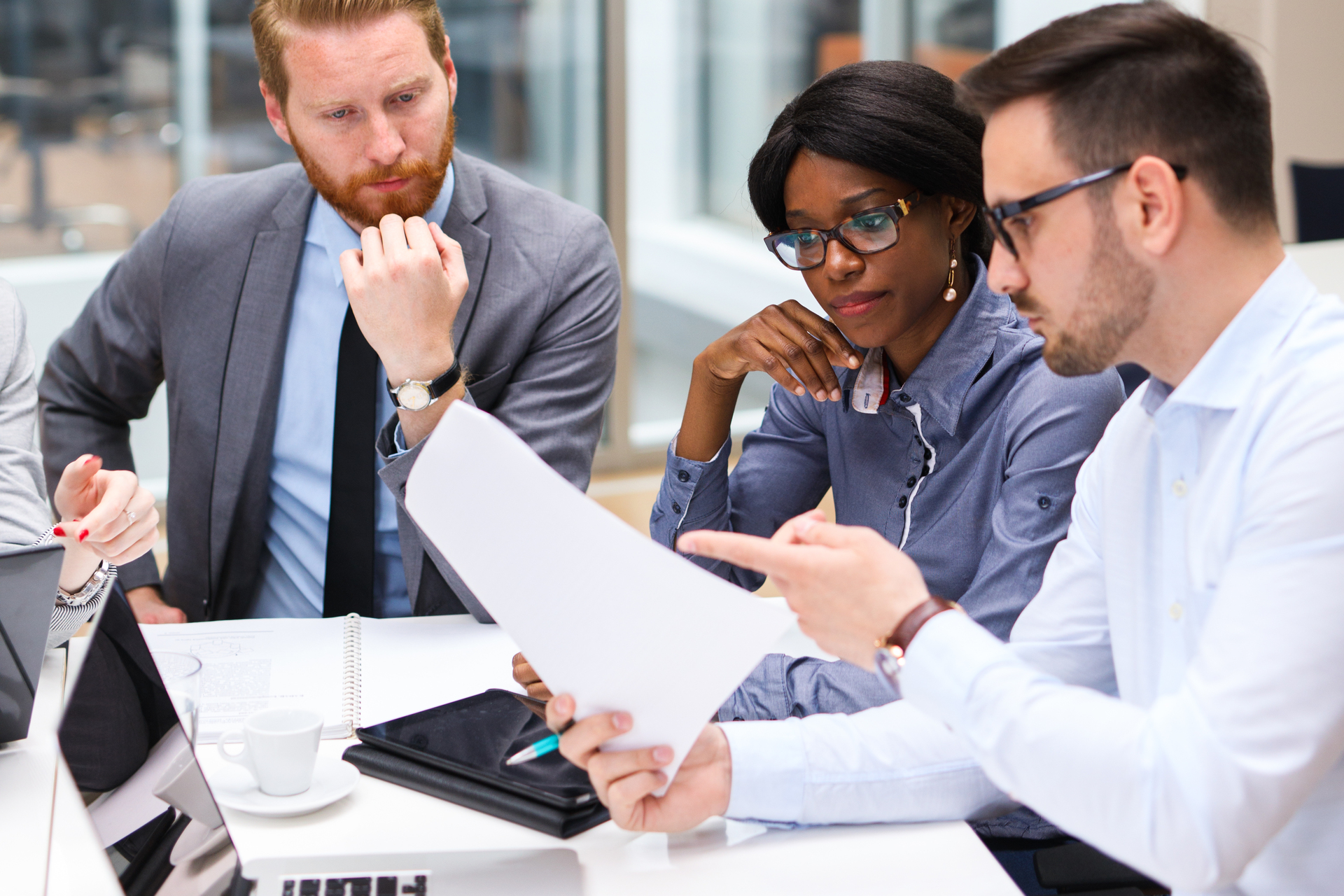 Business people discussing strategy with a financial analyst