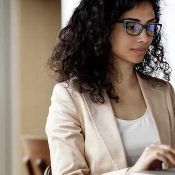 Woman works on laptop