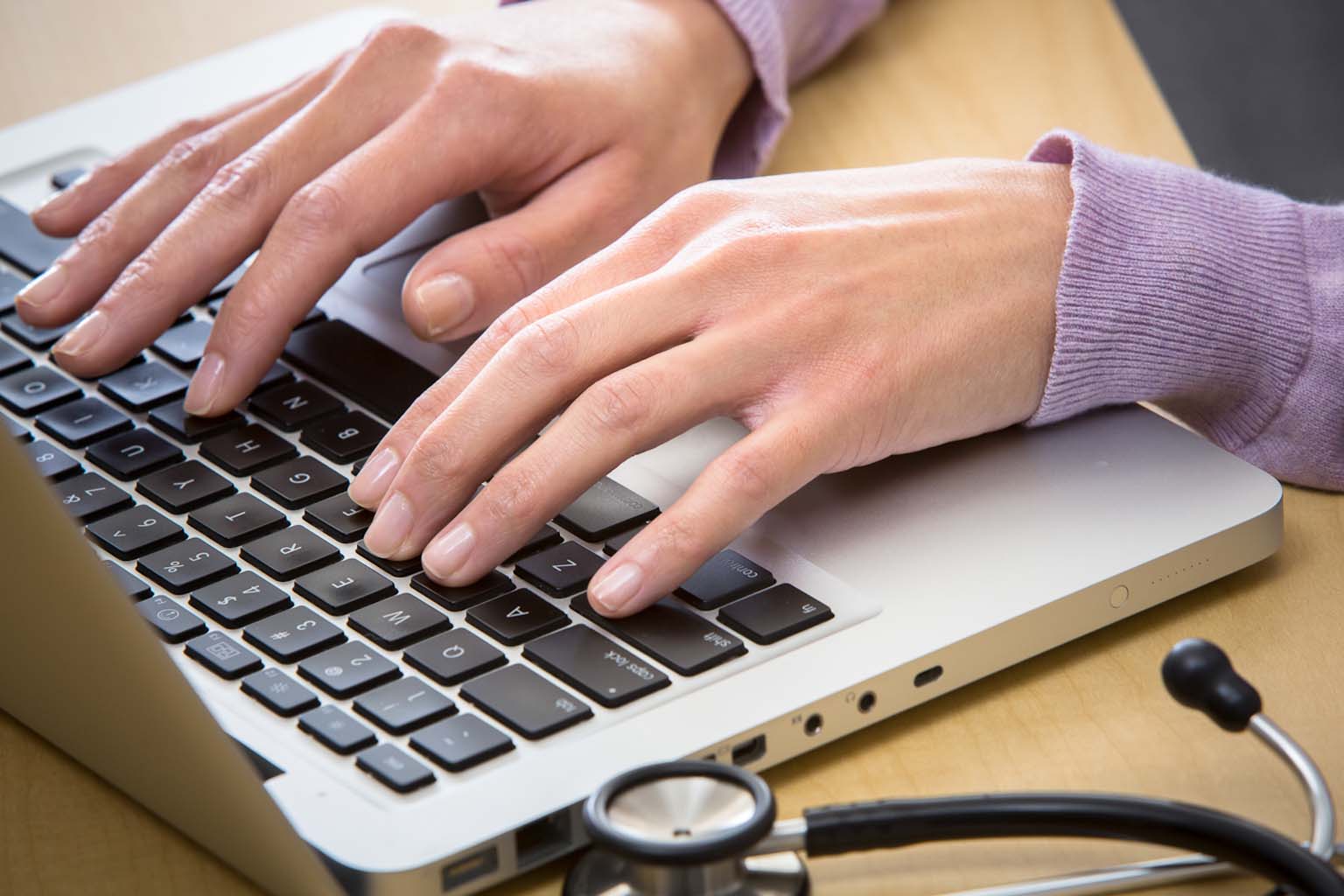 Clinician using a laptop