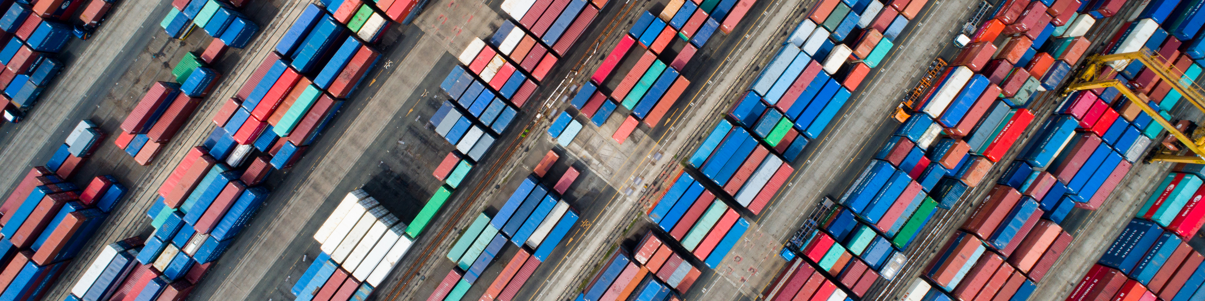 Shipping containers sit stacked in this aerial photograph taken above a port in South Korea. Photographer: SeongJoon Cho/Bloomberg