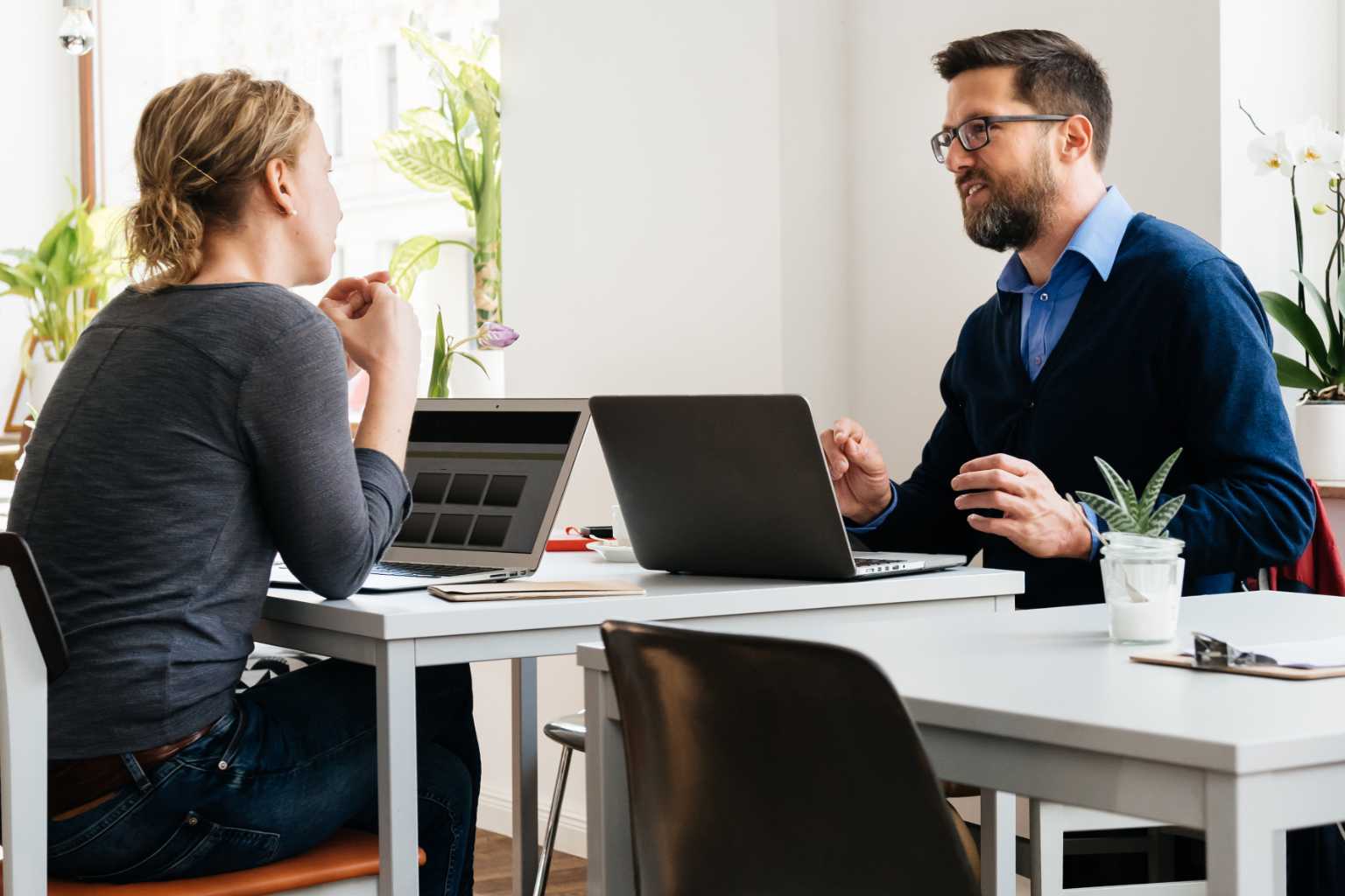 Man and woman on laptops