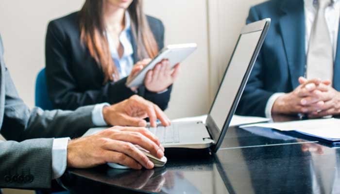 Woman in meeting with tablet