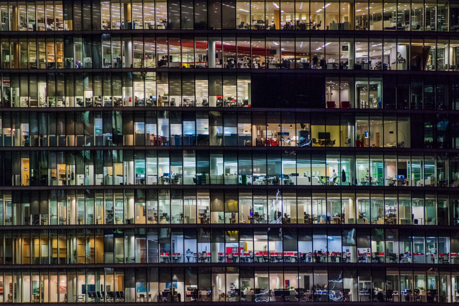 Glass office building at night