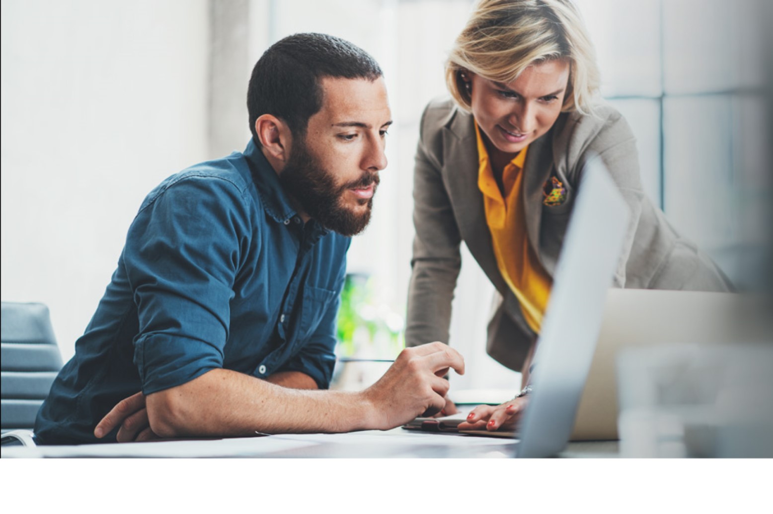 Two people looking at computer