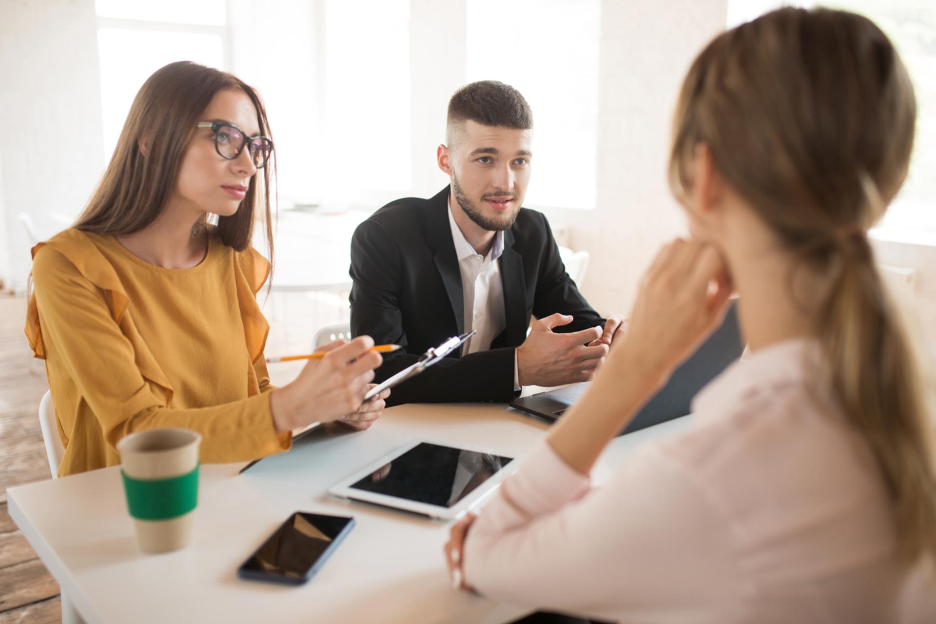 Business employees discussing share amendments