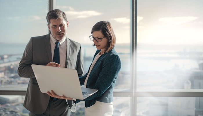 Man and woman looking at laptop