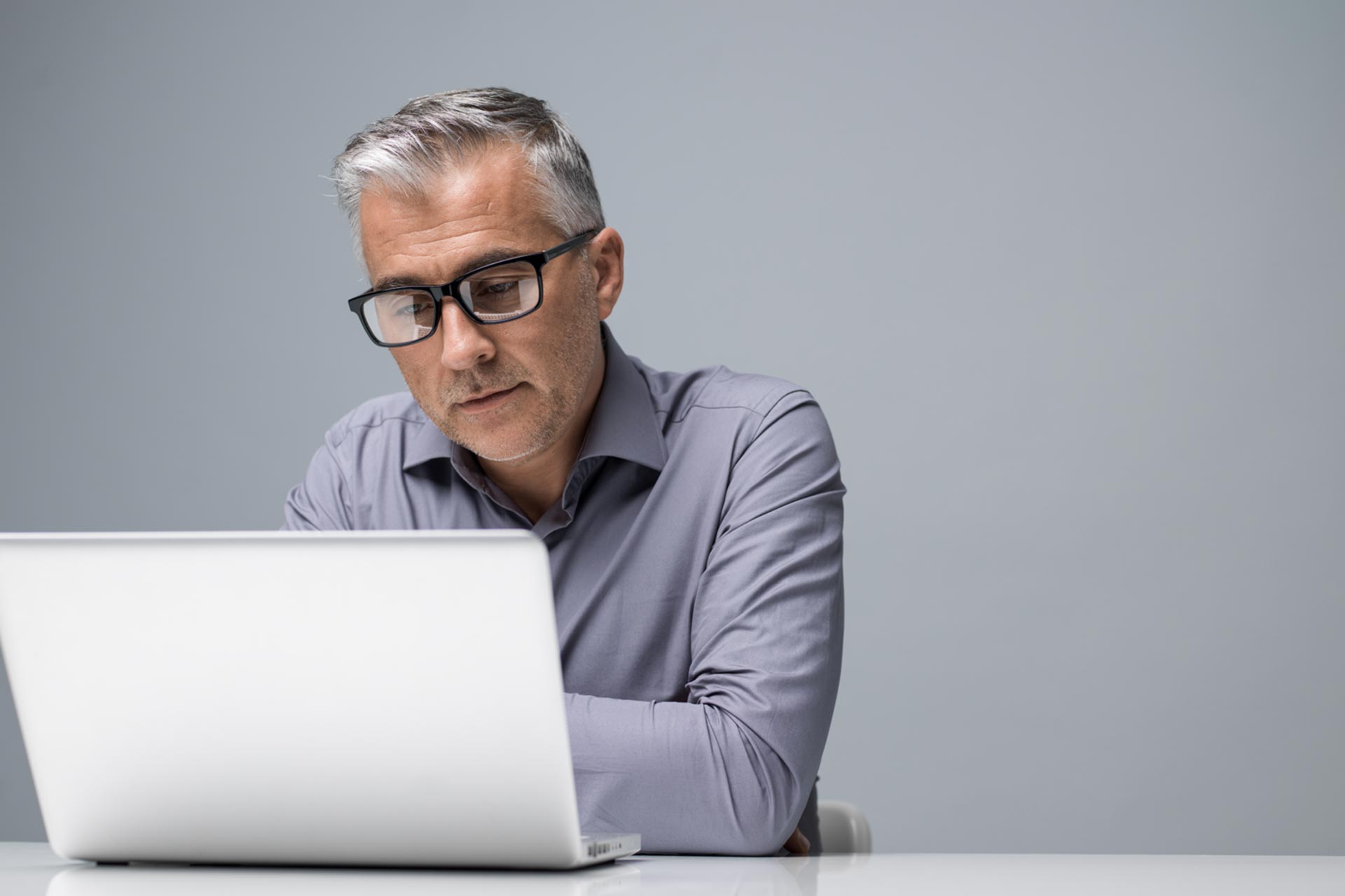 Man doing professional corporation work on his laptop