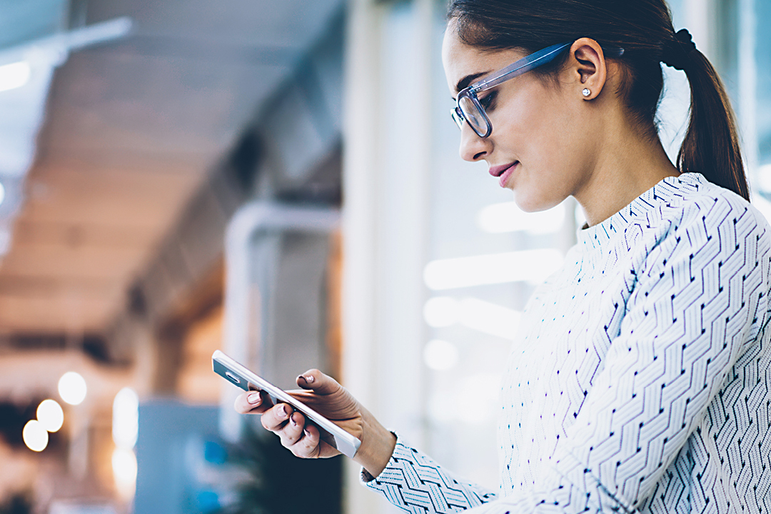 Business woman signing document via smart phone