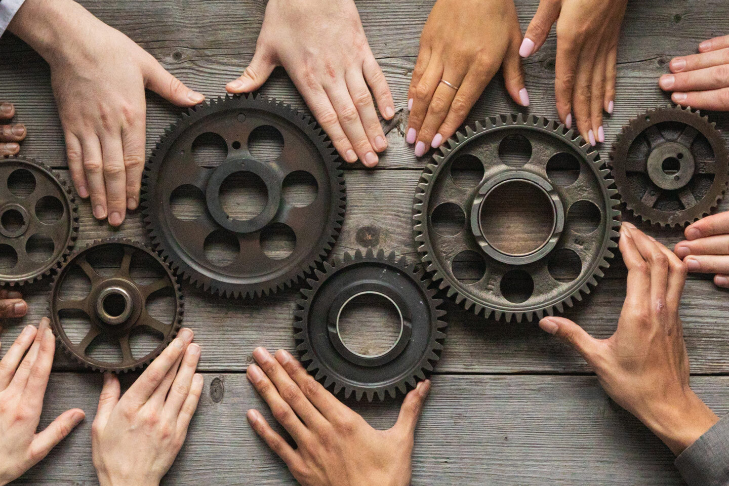 Combined Assurance Hands Holding Gears