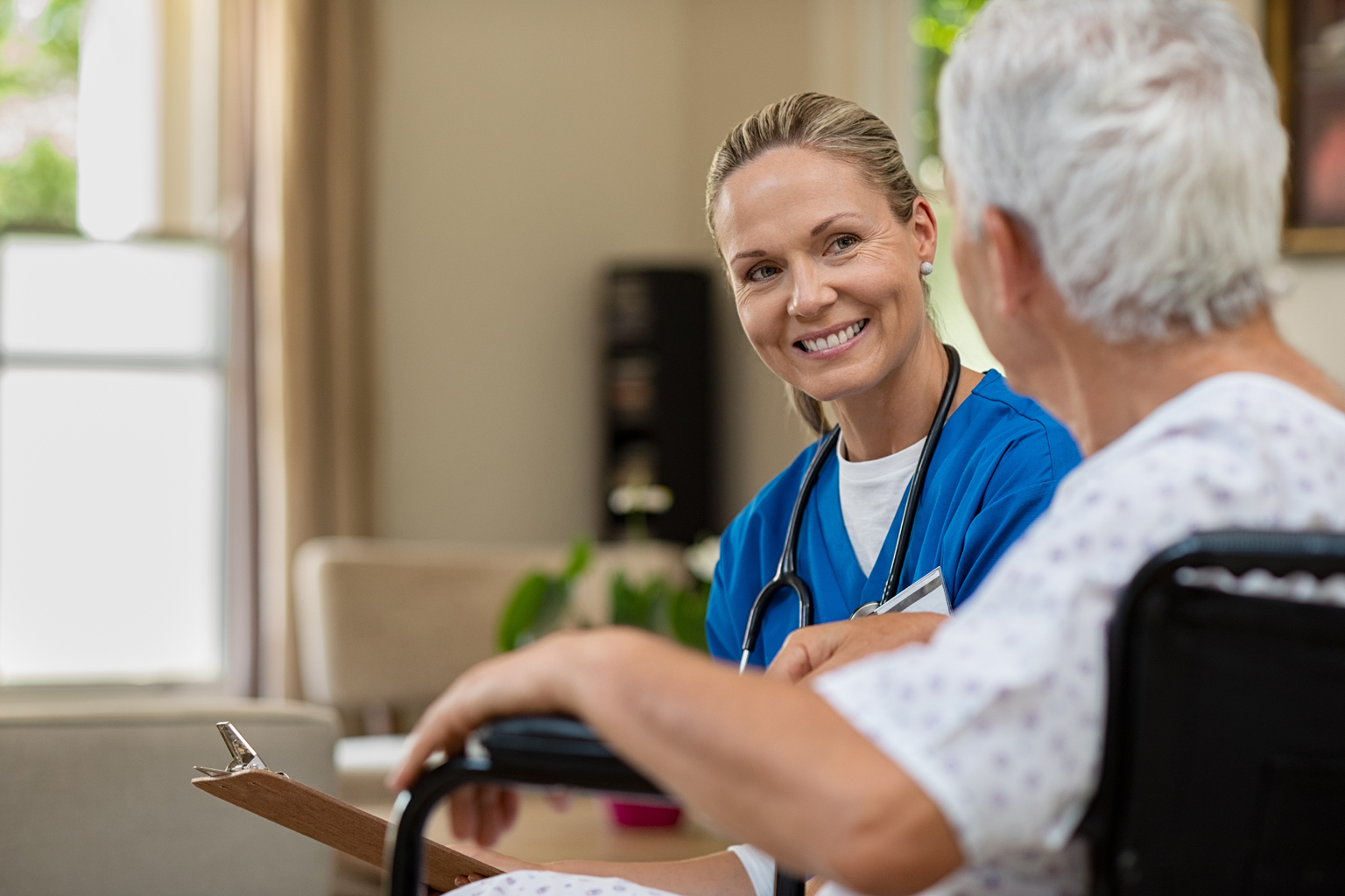 Home health nurse smiling at patient