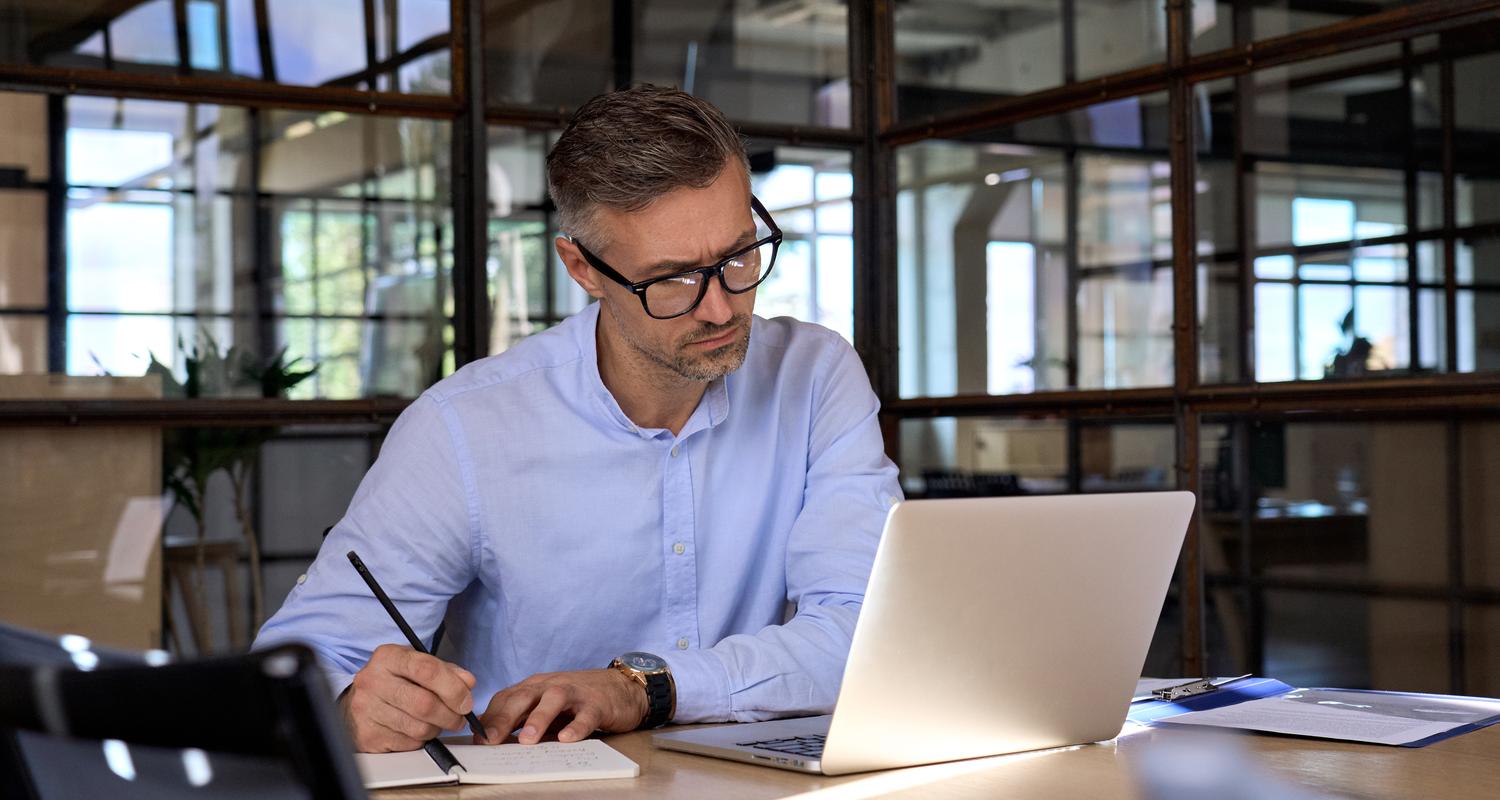 businessman w laptop at office