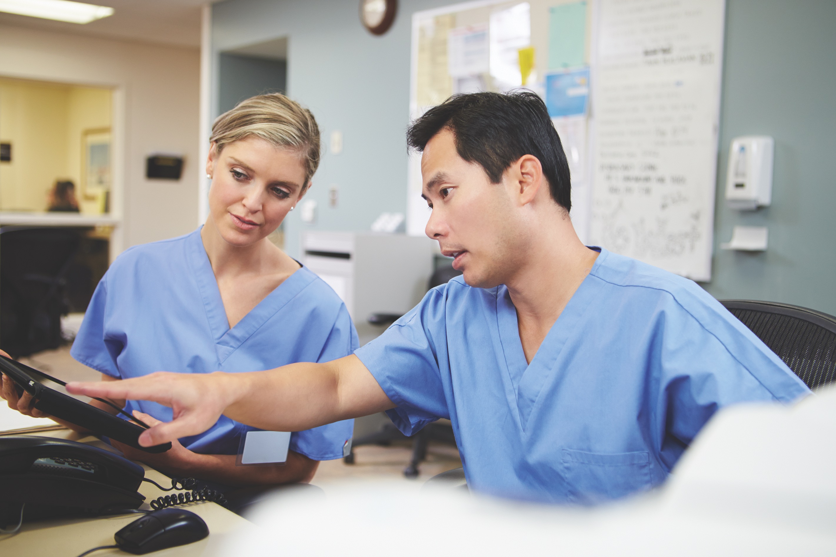 Nurses looking at computer screen