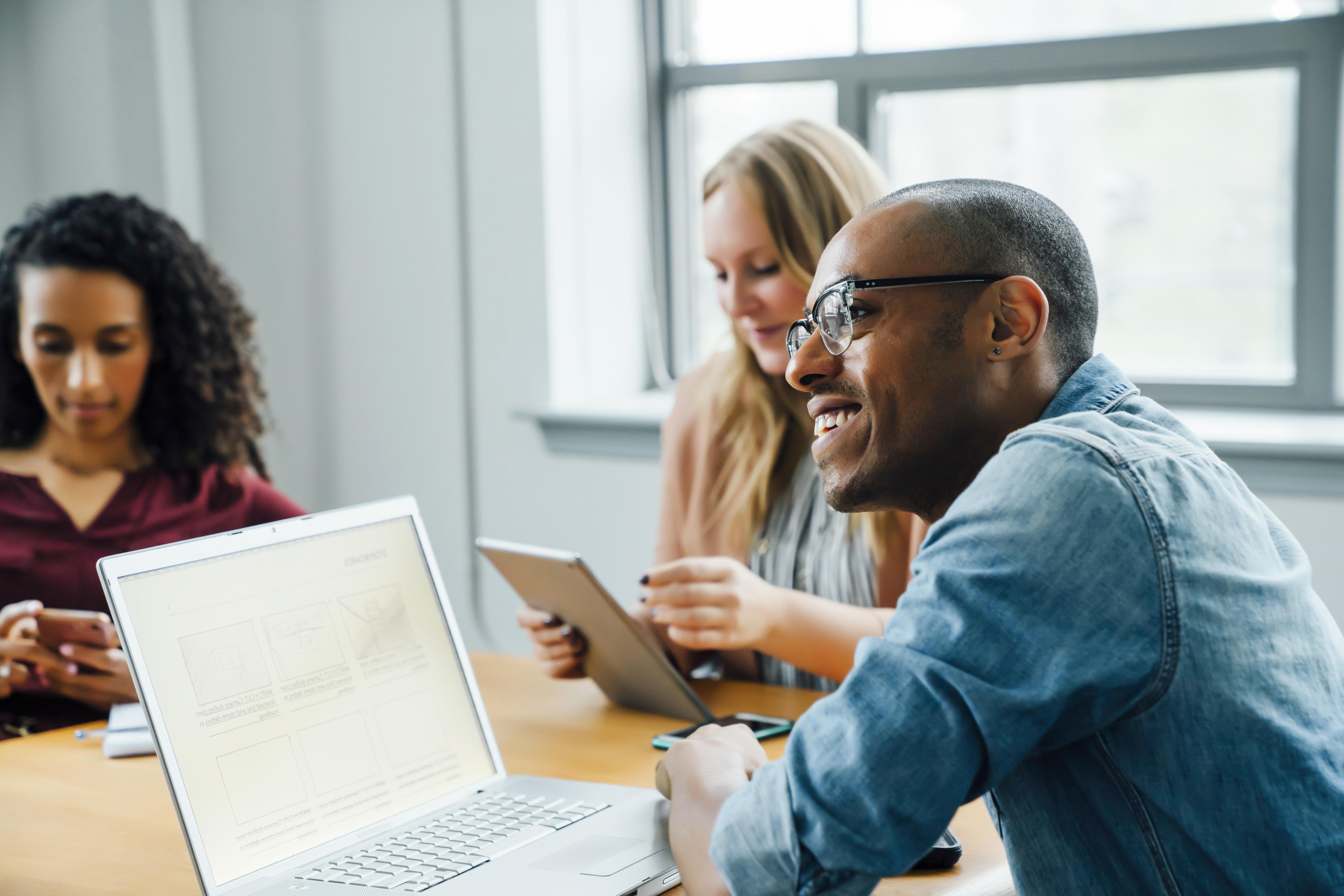 Business people using technology in meeting. Digital Life. OneWebGetty2021