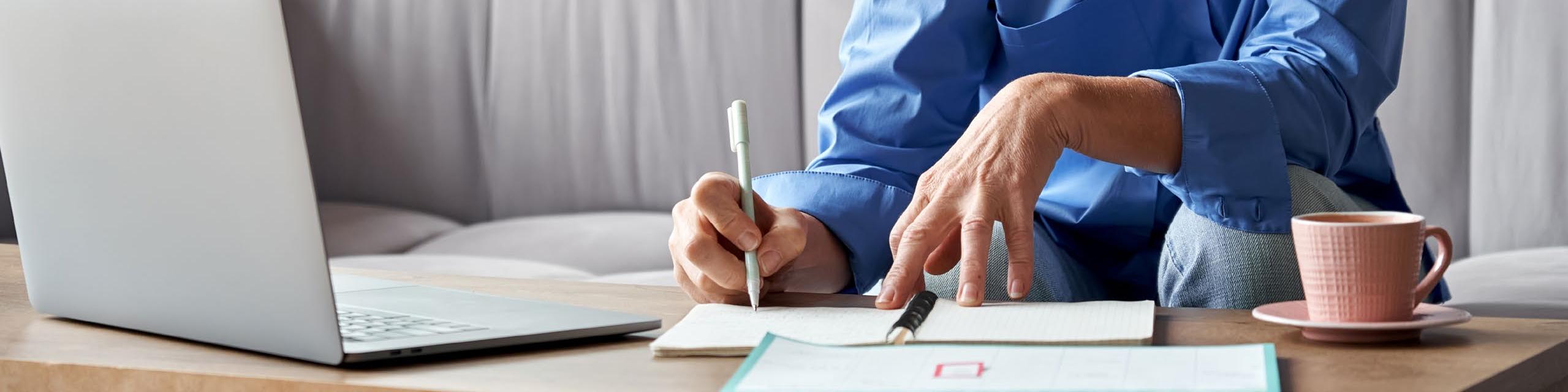 Woman writing in a notebook