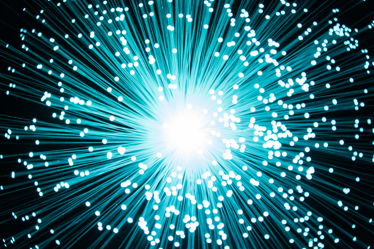 Illuminated Fiber Optics One Point Perspective Radial Pattern Against Black Background.