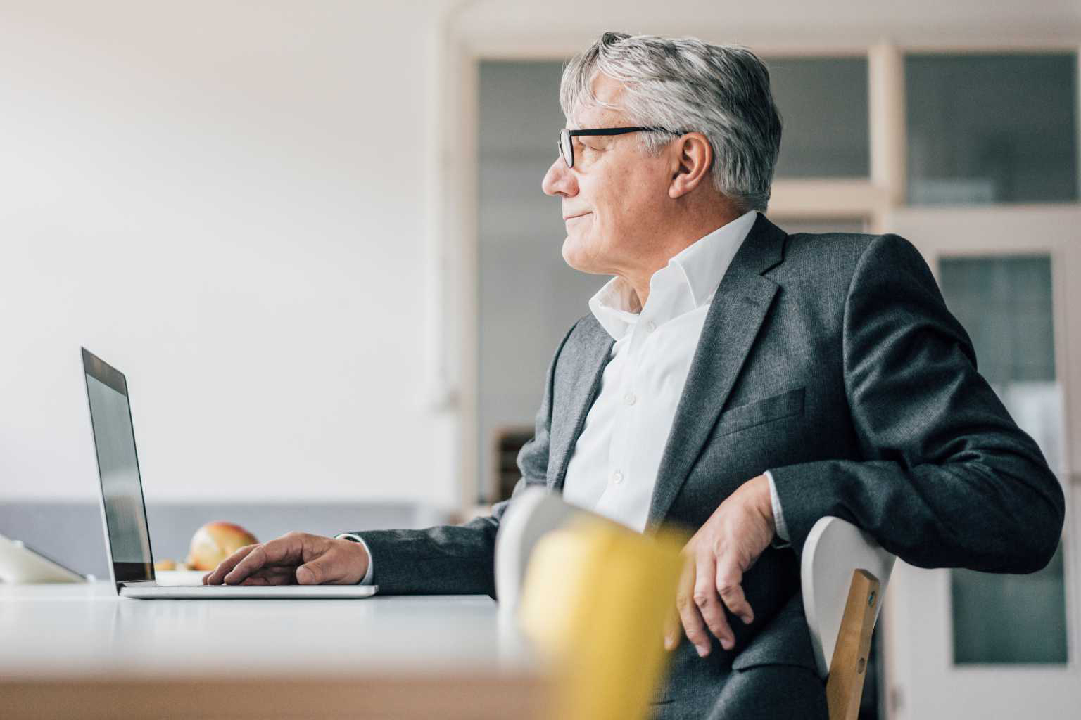 businessman-with-laptop-at-desk