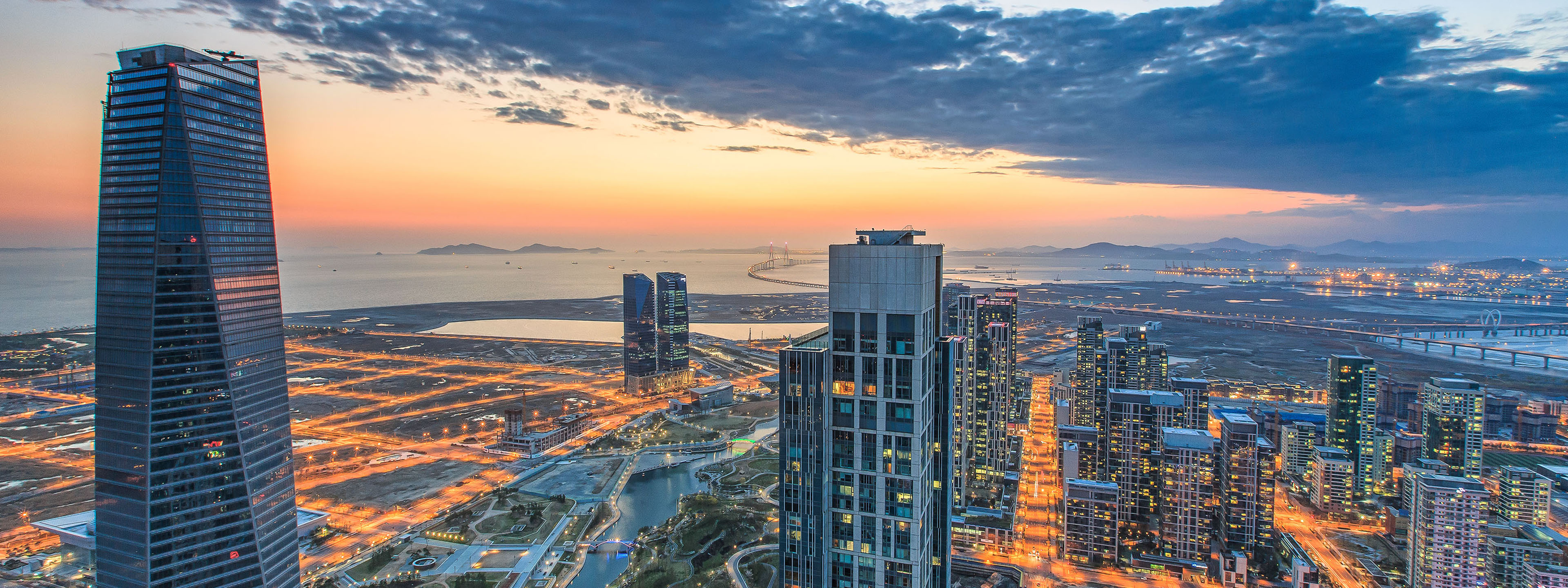 sea bridge coast city sunset dusk lighting skyscraper building cloud Korea skyline