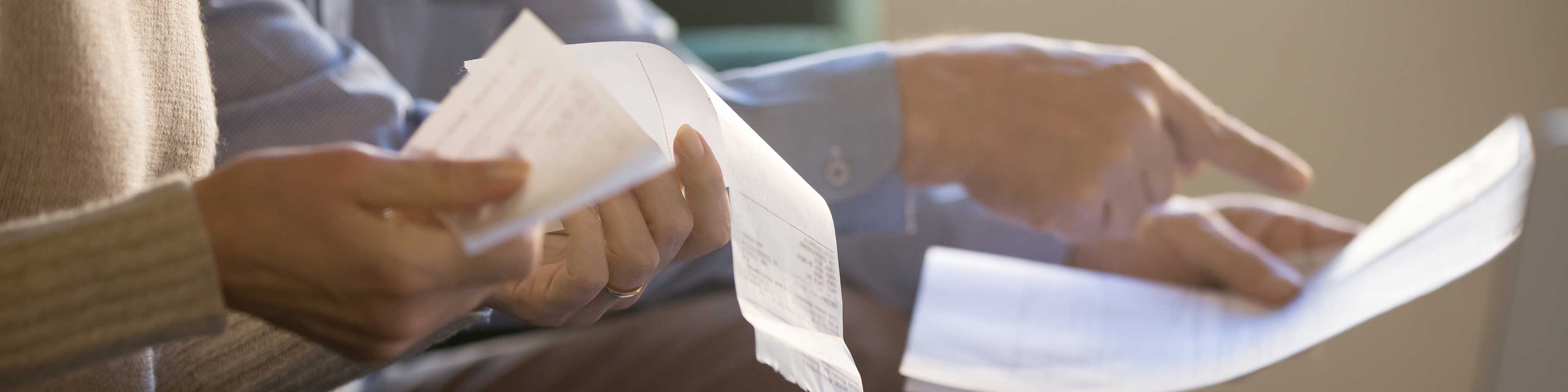 Woman looking at receipt