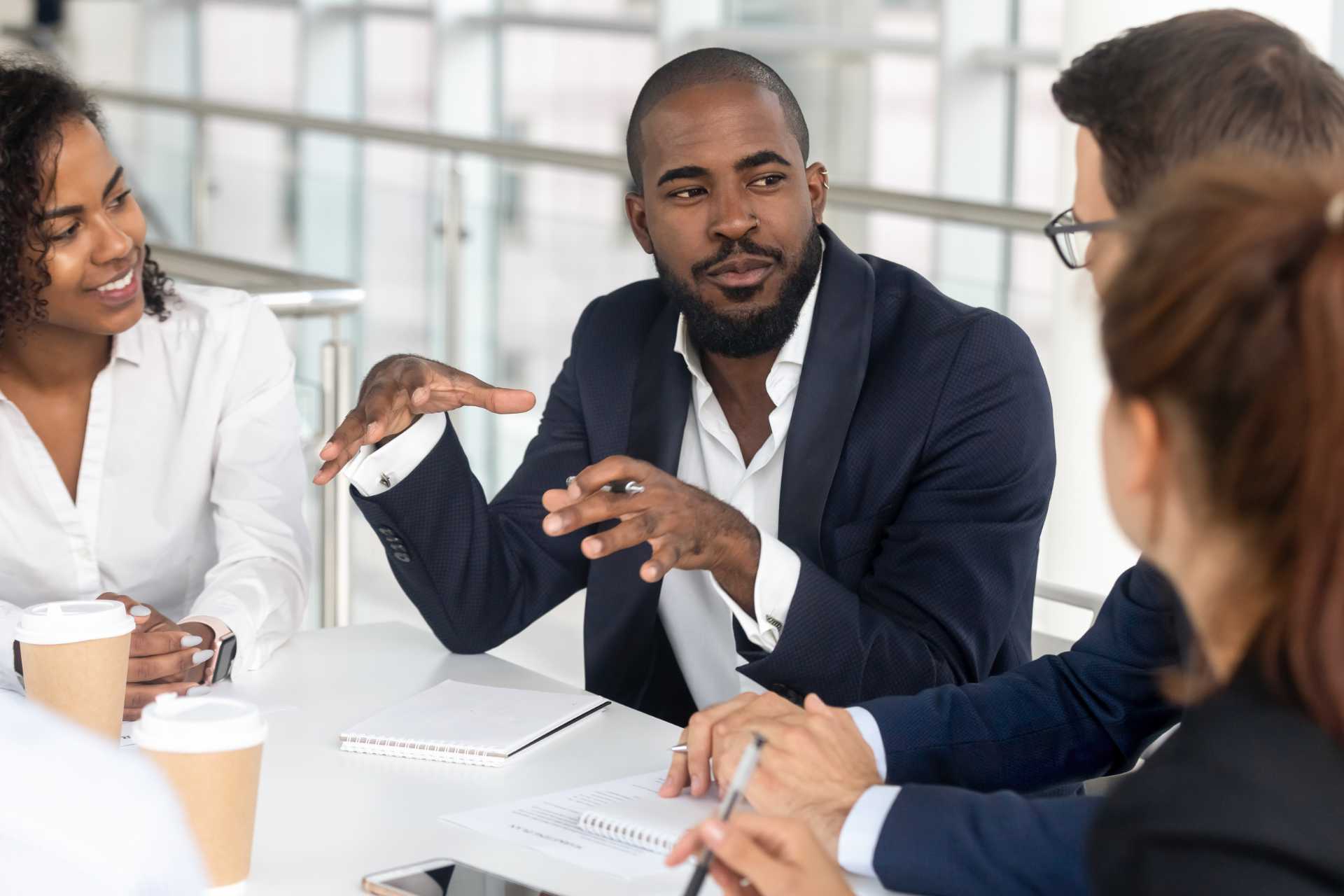 Man leads group meeting