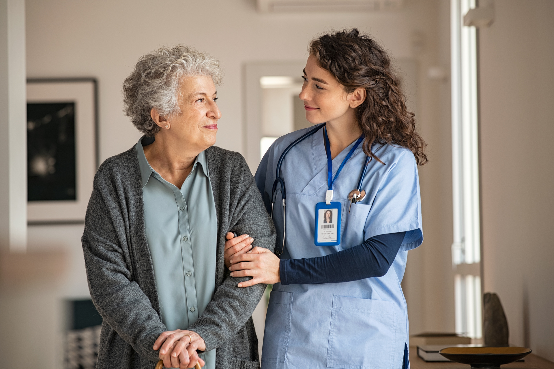 In home nurse provides care to senior patient