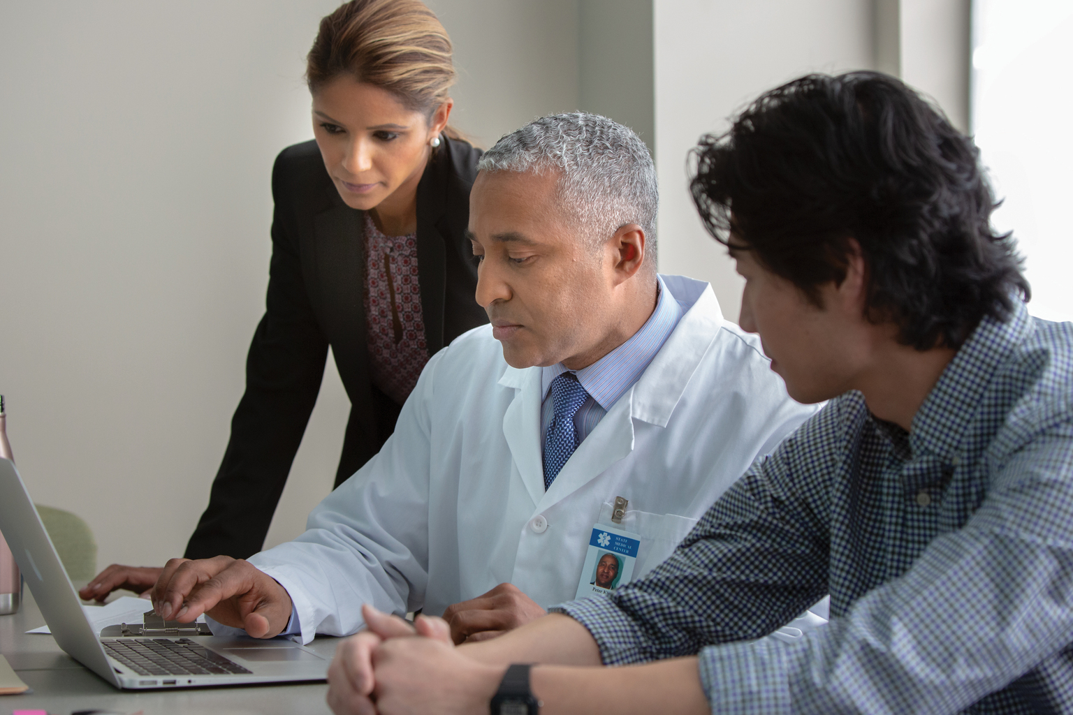 hospital staff veiwing laptop