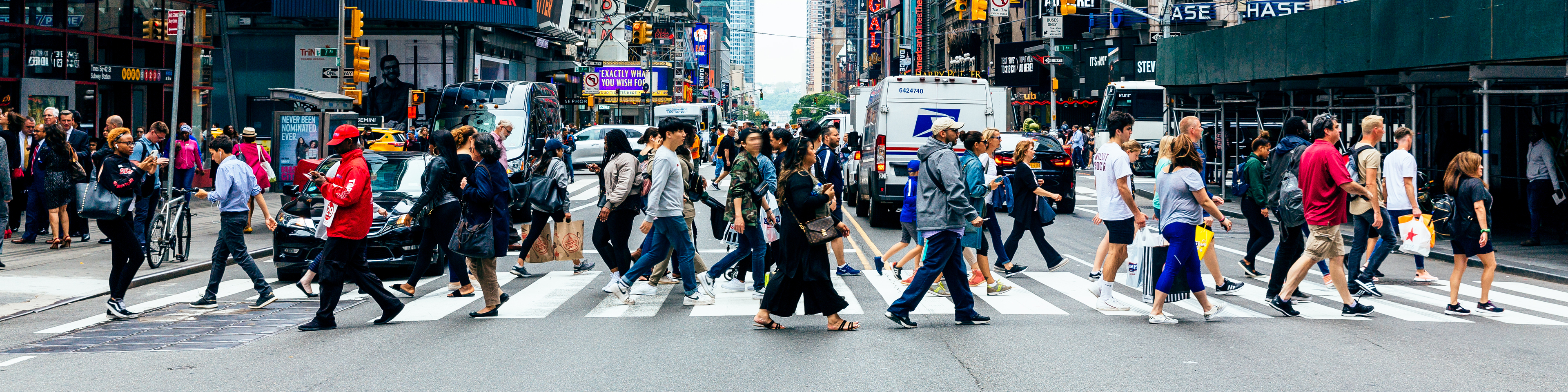 Crowd crossing street in New York City.