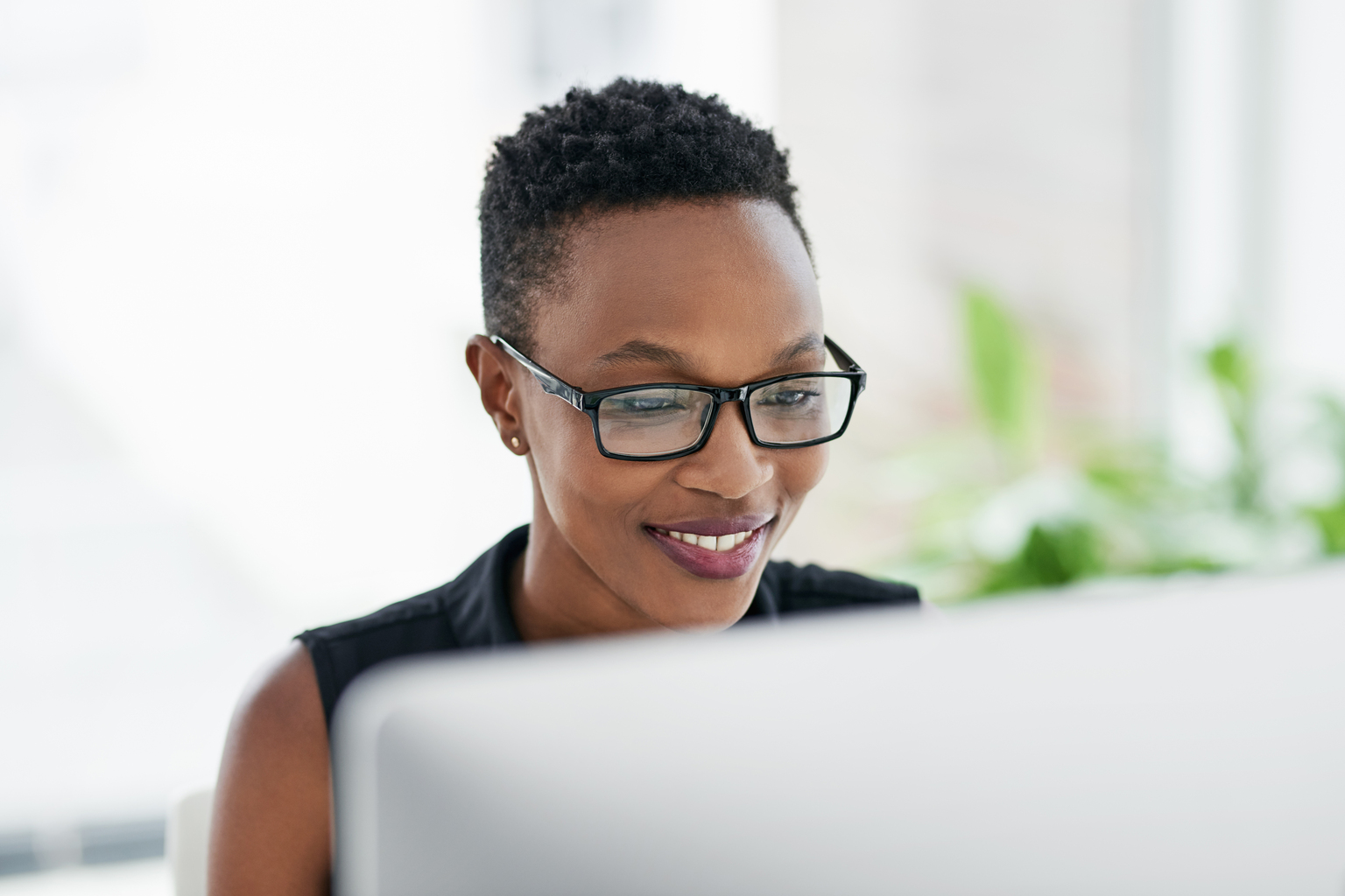 woman looking at a monitor 