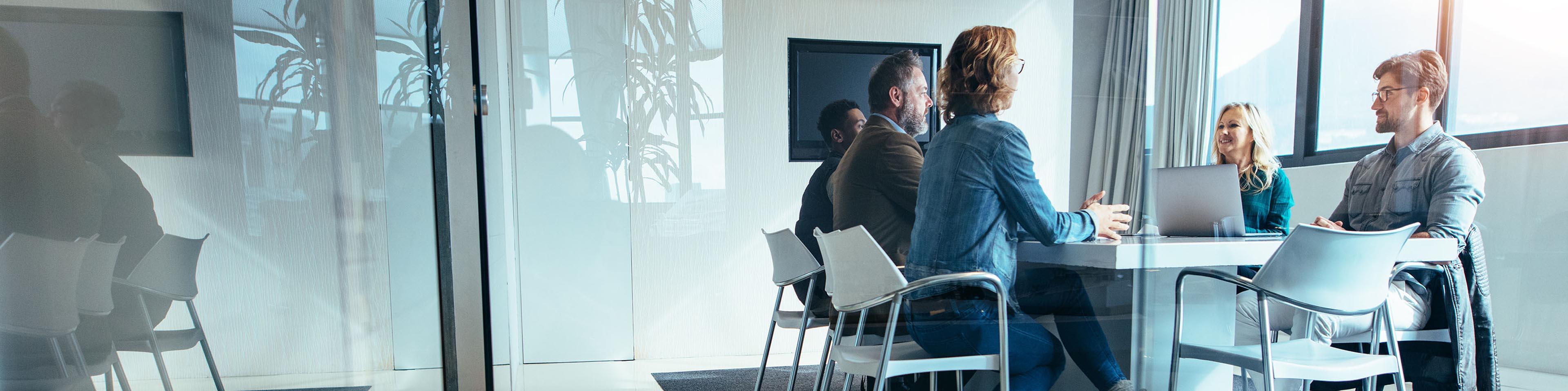 business people in a small meeting room