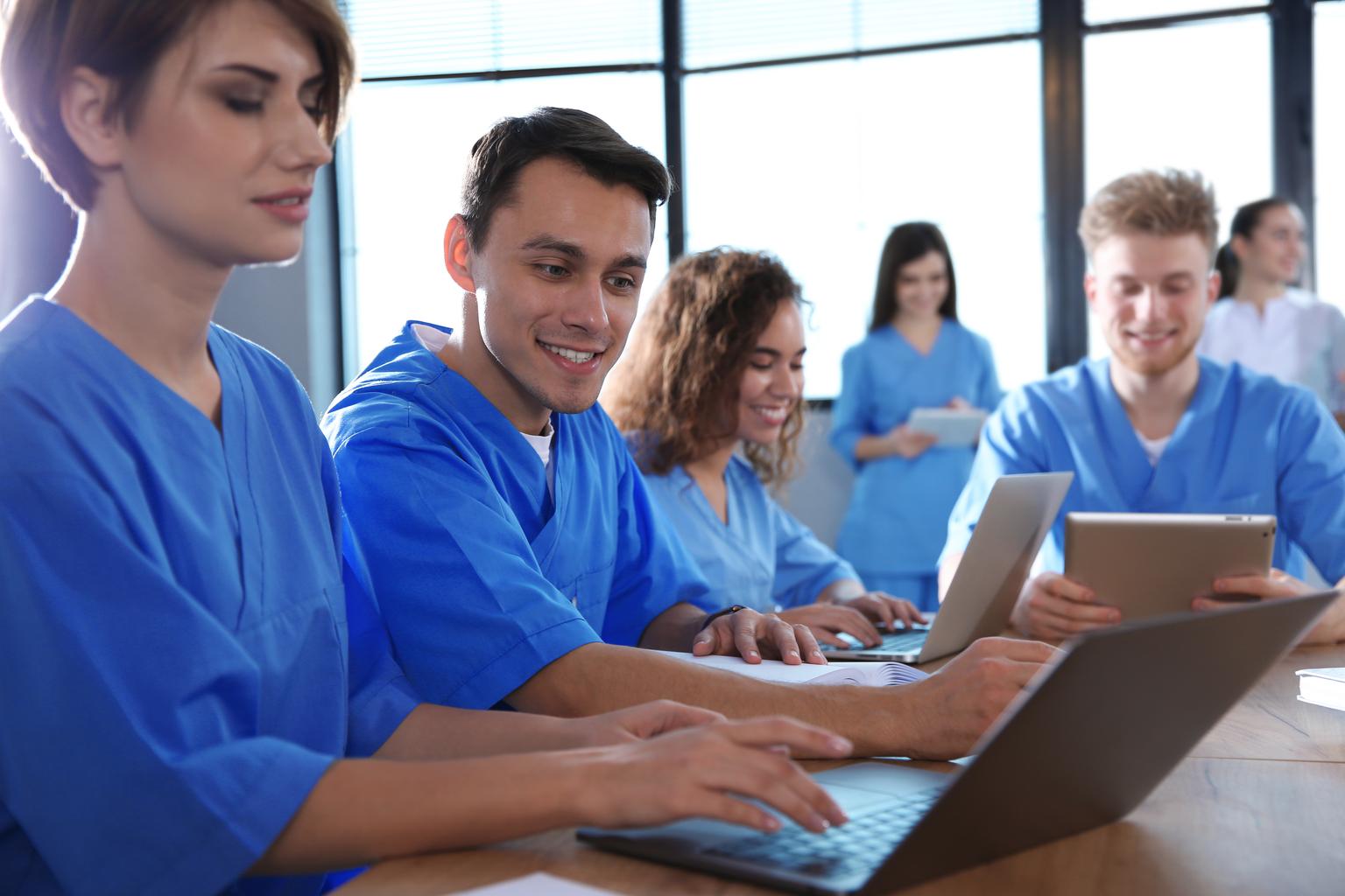 Group of medical students in a study group using Ovid Synthesis Clinical Evidence Manager