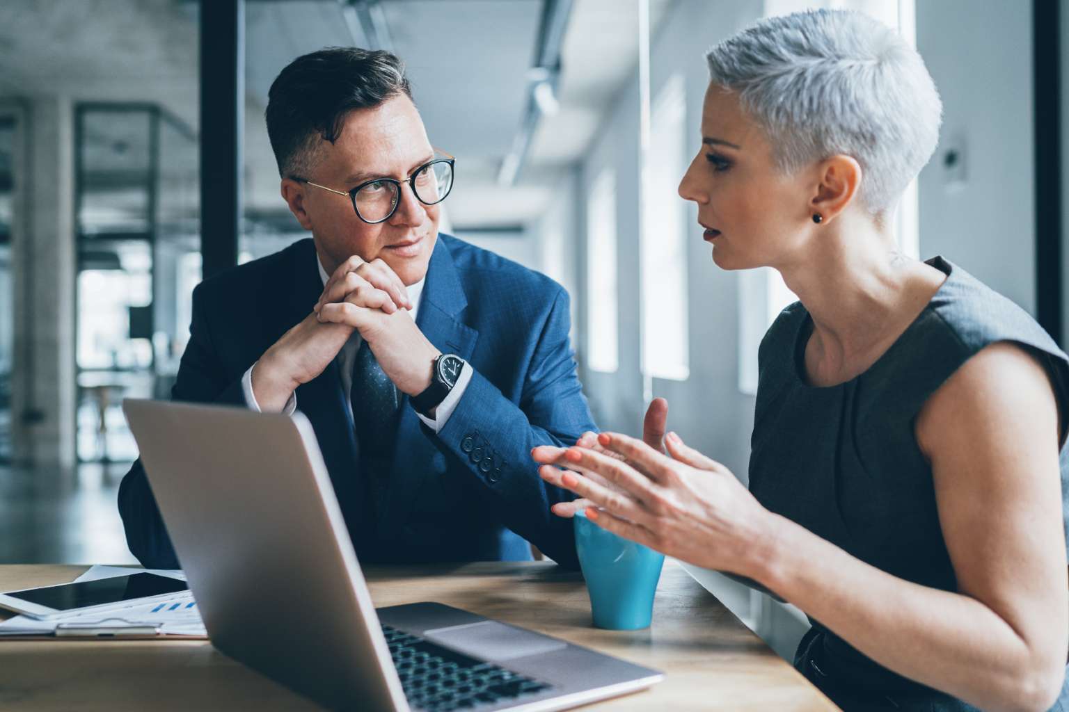 Two business people with laptop