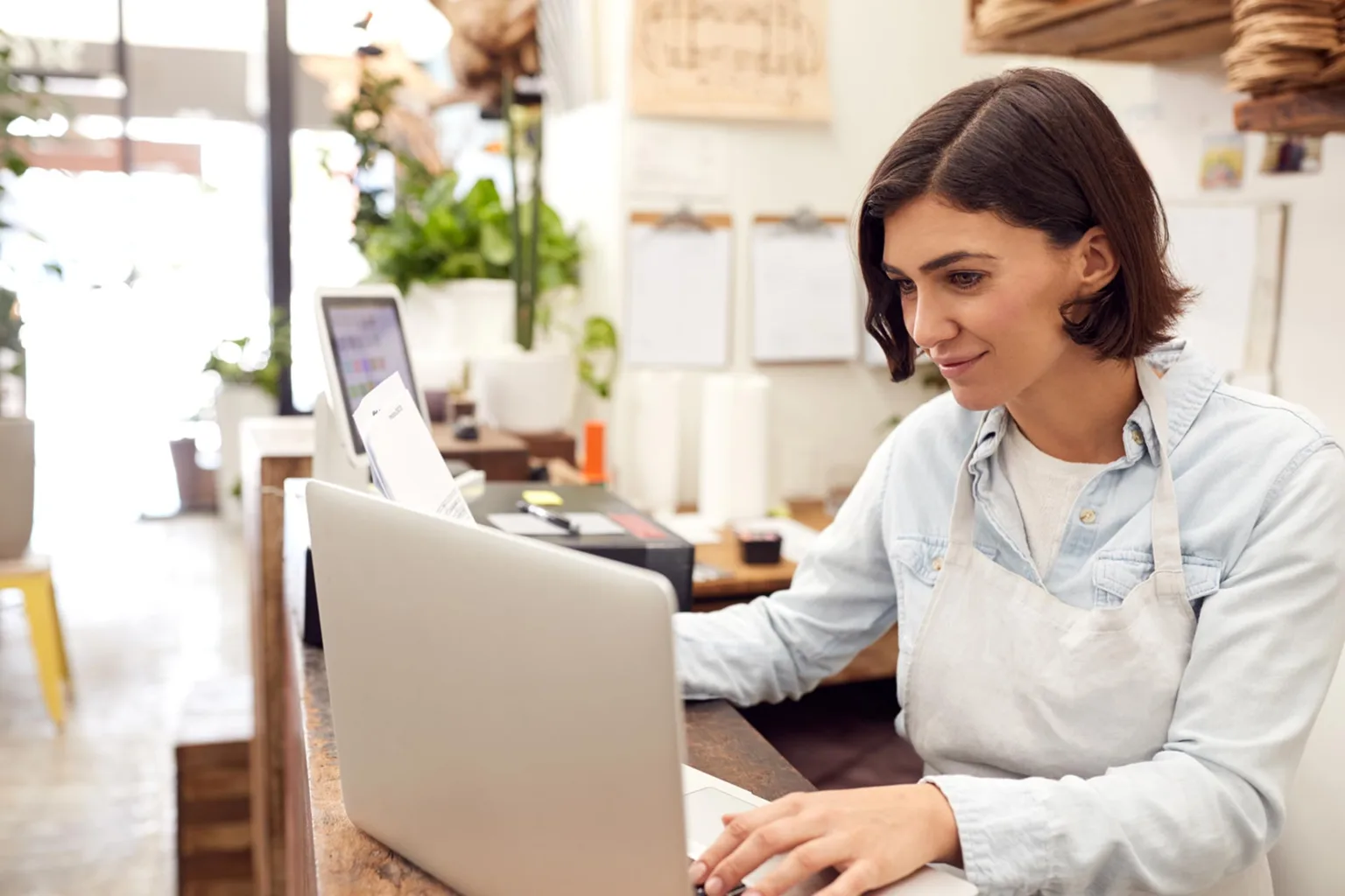 DBA business owner checking her laptop