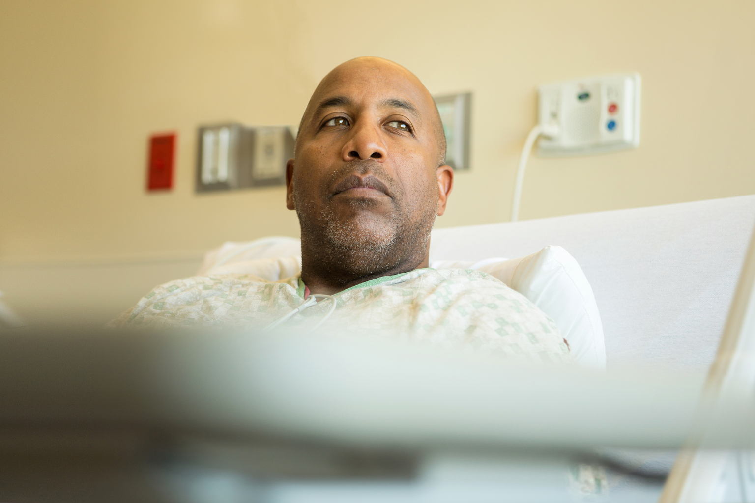 African American patient in hospital bed