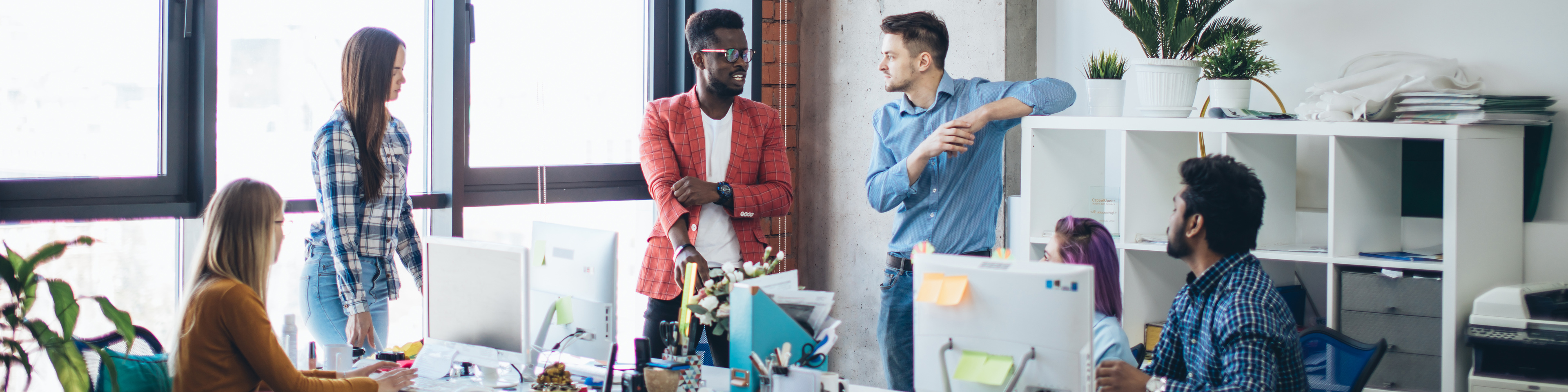 modern business office interior with colleagues talking