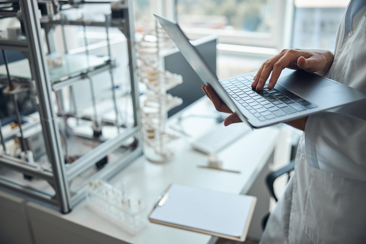 Medical professional holding a laptop 