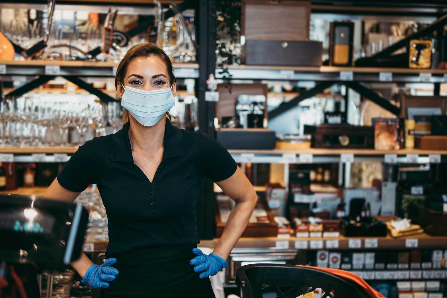 female food service cashier wearing mask
