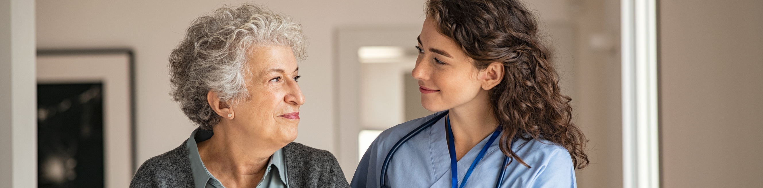 In home nurse provides care to senior patient