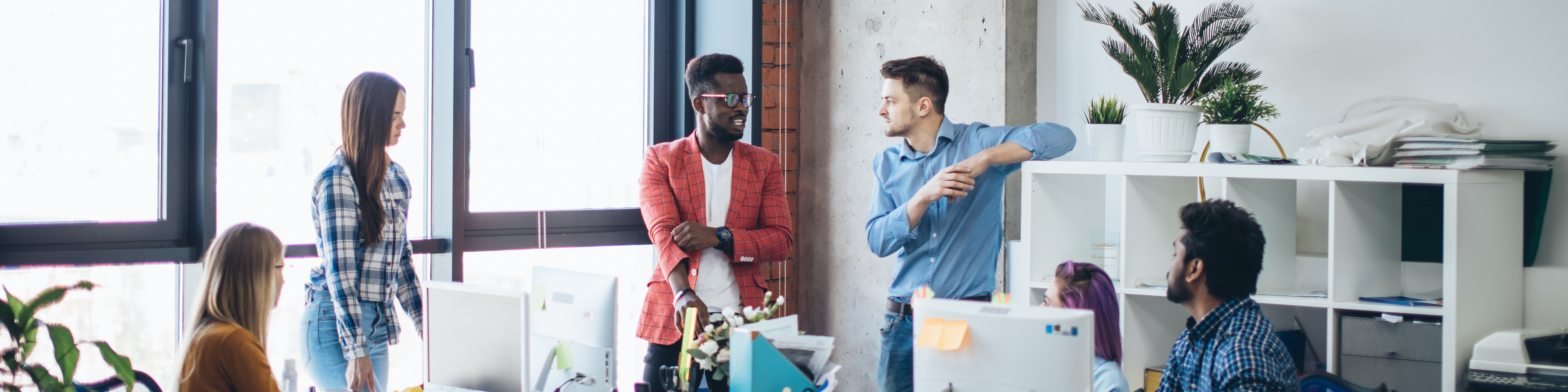 modern business office interior with colleagues talking