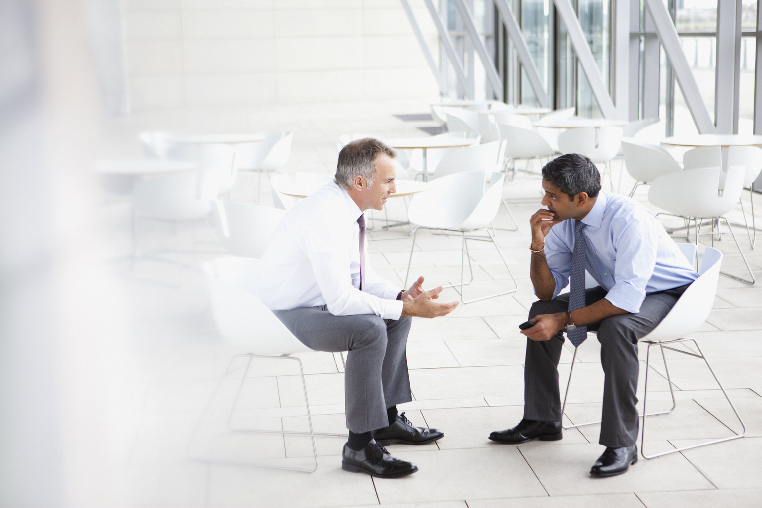 Businessmen in meeting with client