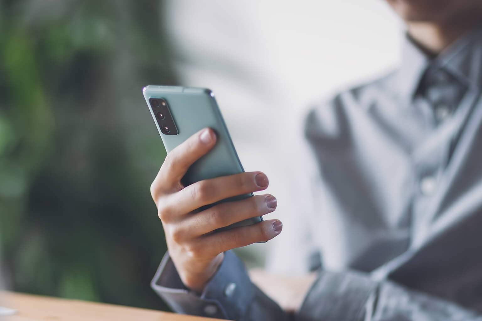 A man looking at a smartphone