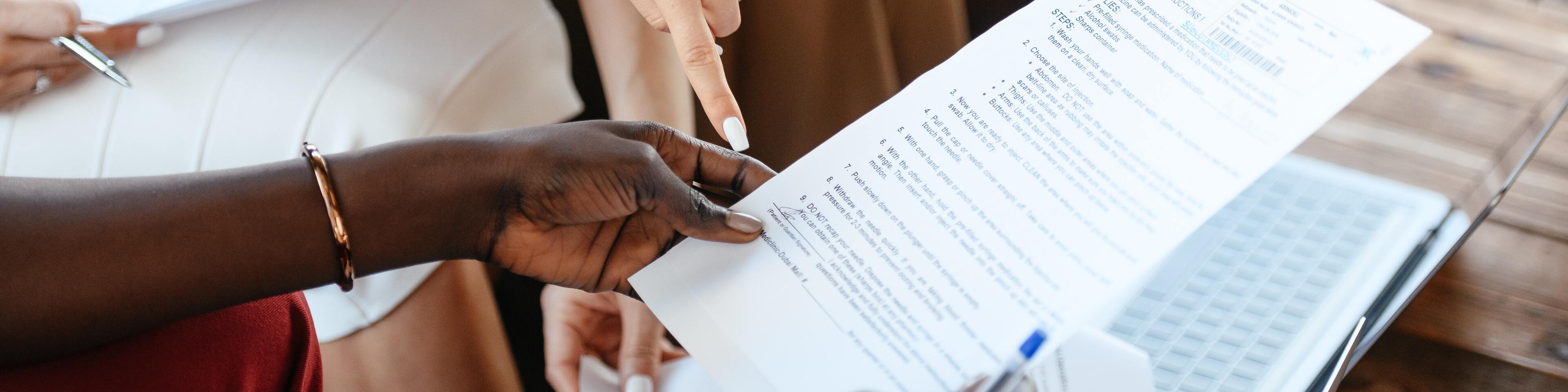 People looking at document