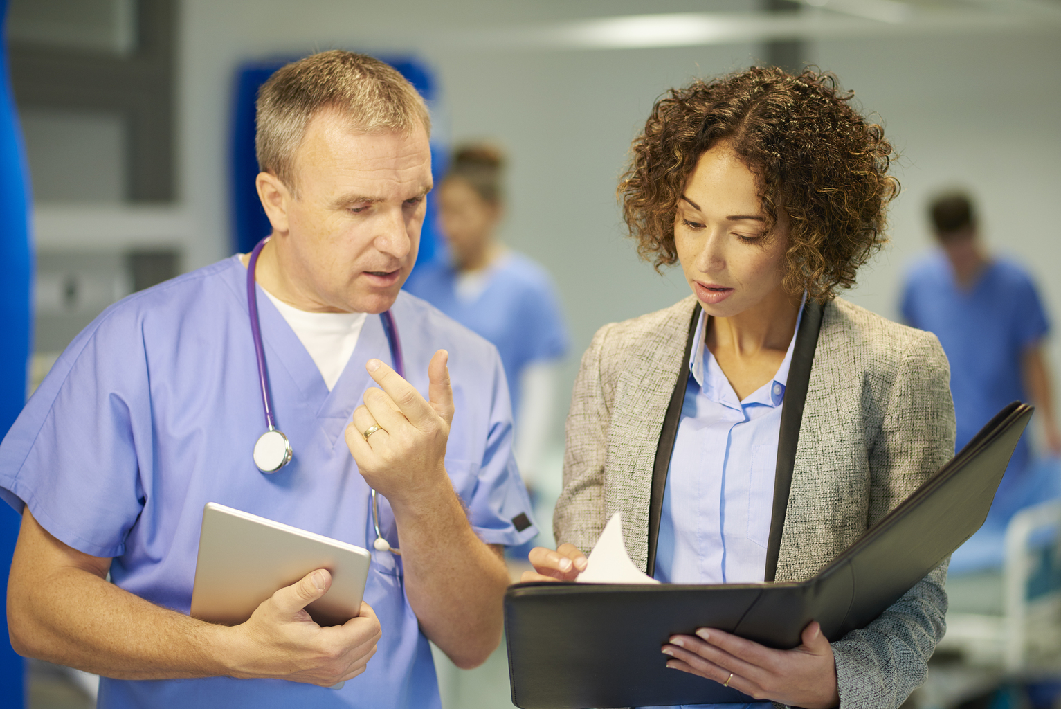 Two healthcare professionals working together