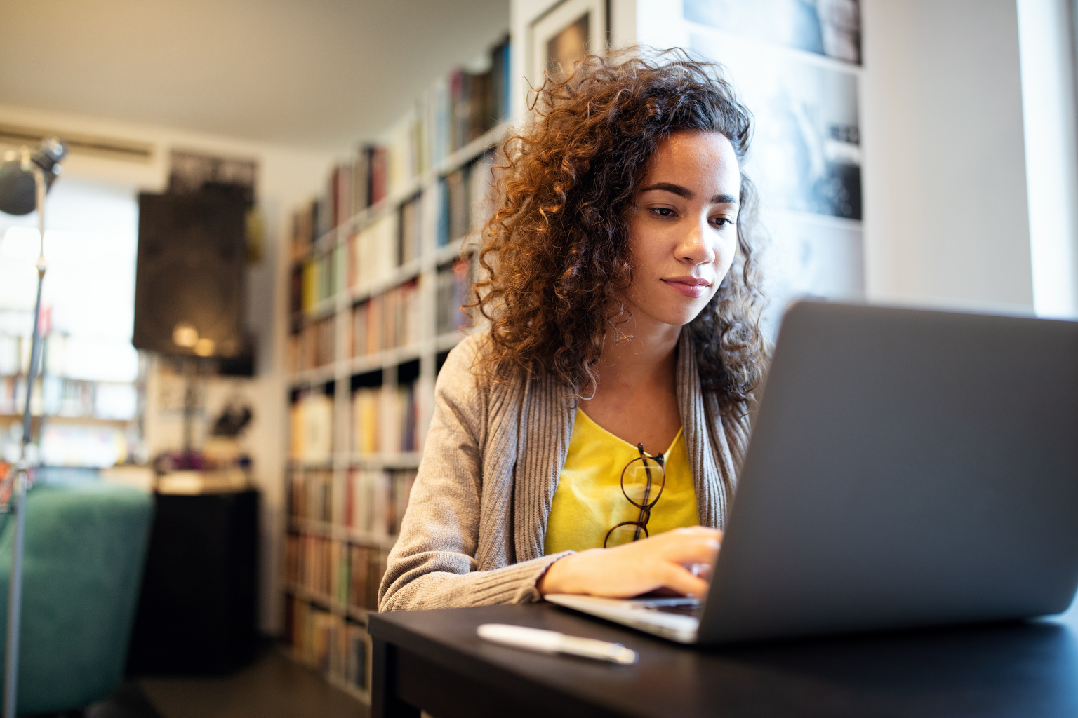 Med student studying using laptop in library