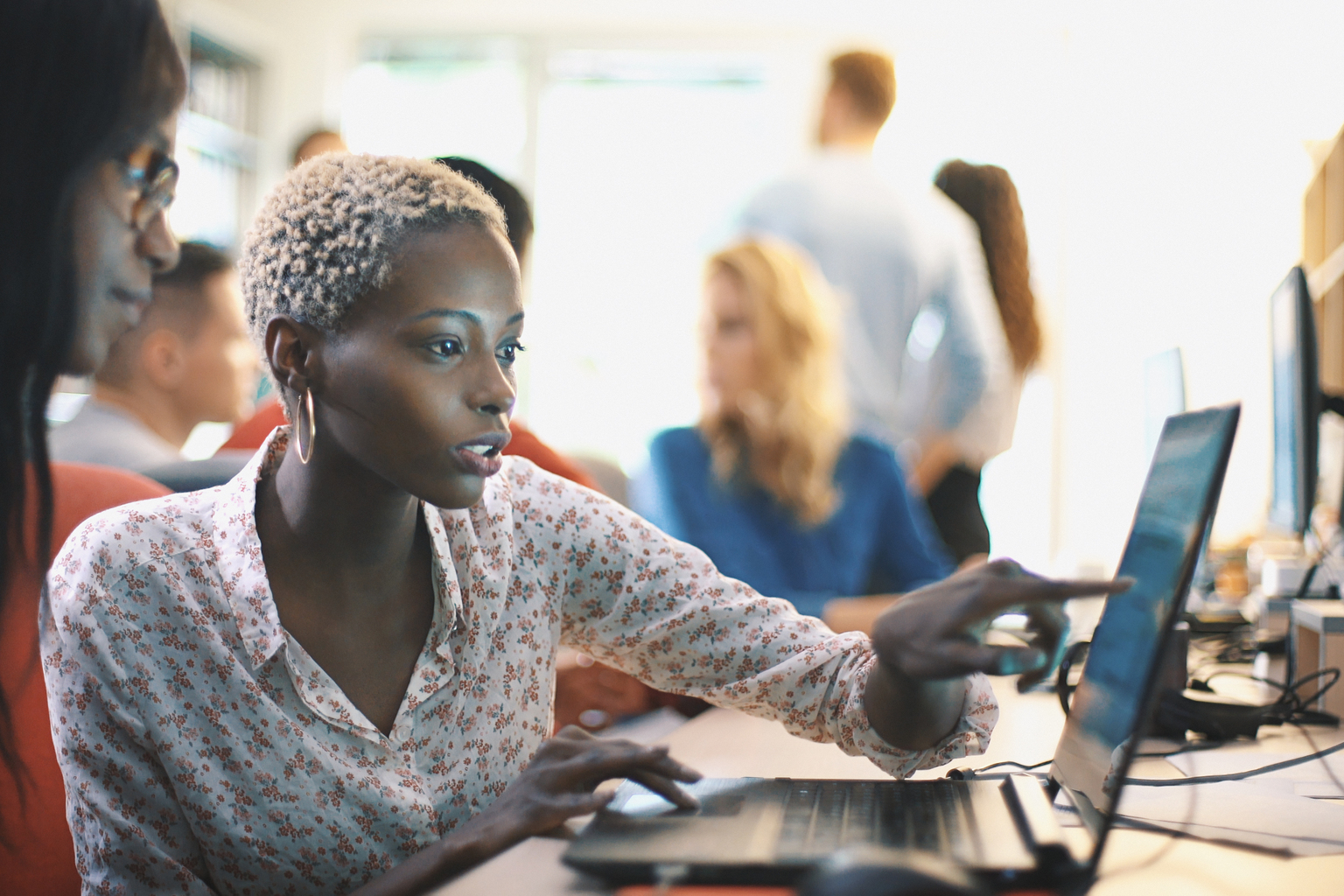 Black woman discussing over the laptop