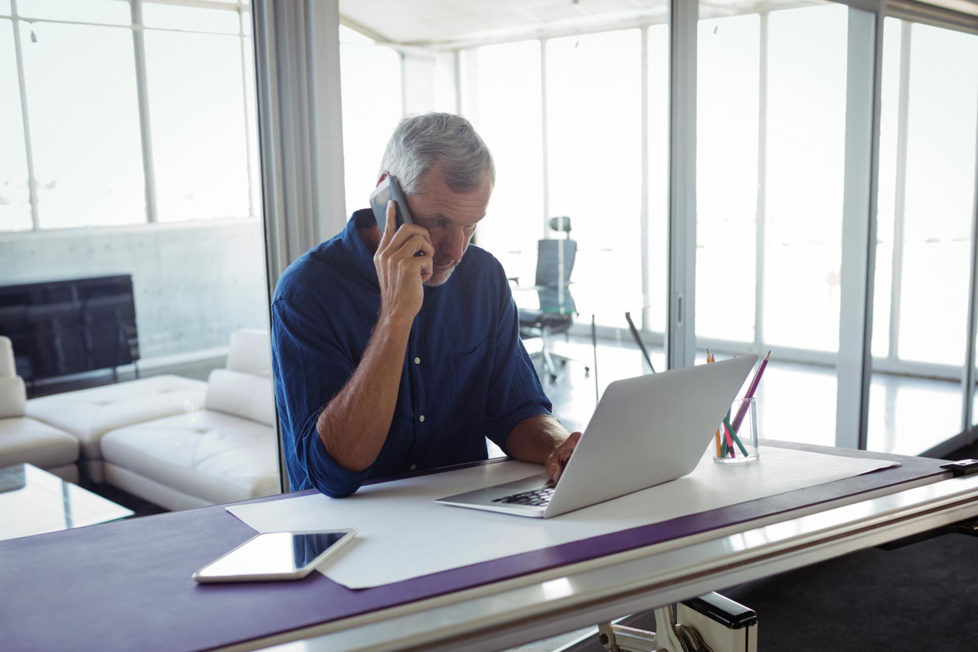 Man reinstating his business on the phone