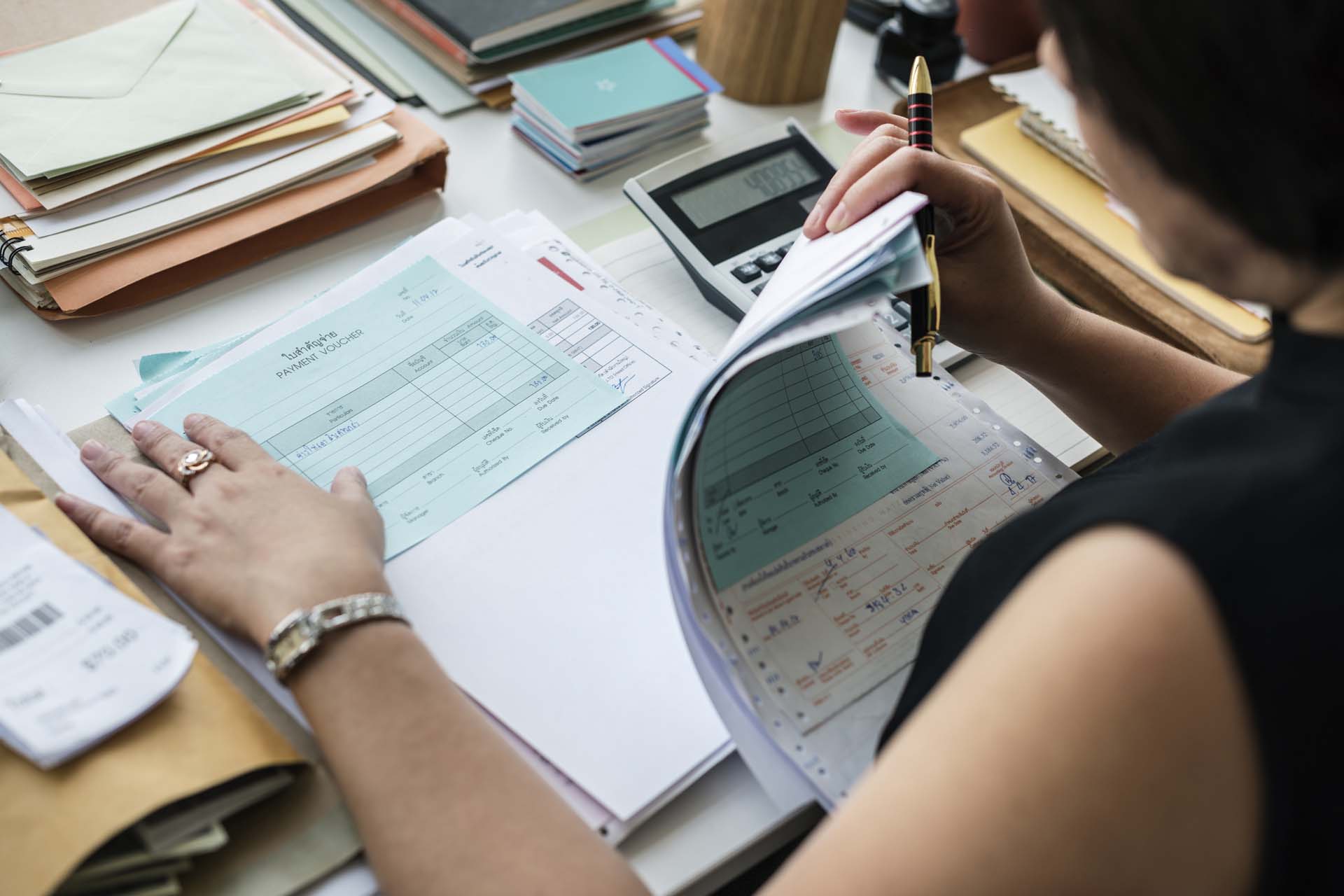 woman reviewing factoring documents