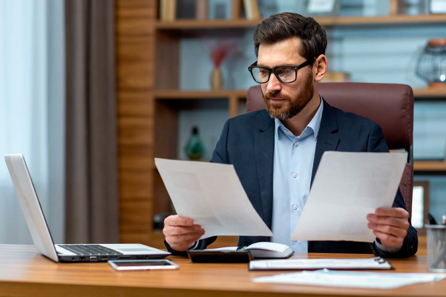 a man looking some documents.png